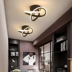 Moderne LED-Deckenleuchte mit verschlungenen Leuchtringen