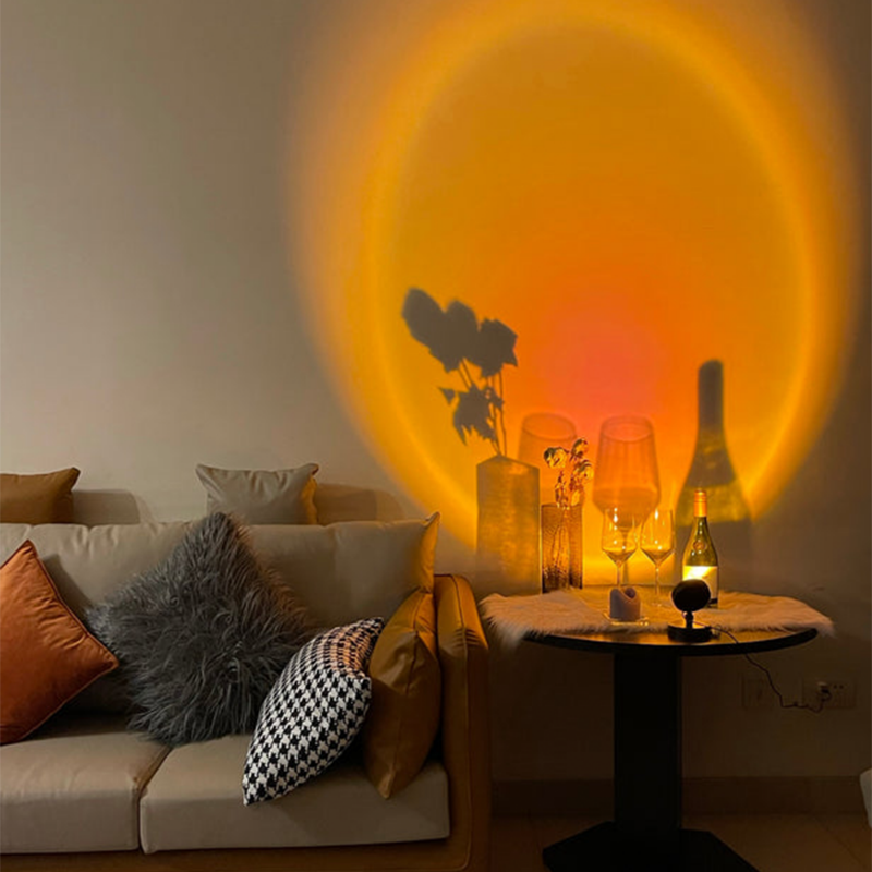 LED-Tischlampe mit rundem Standfuß und farbigem Lichtschein