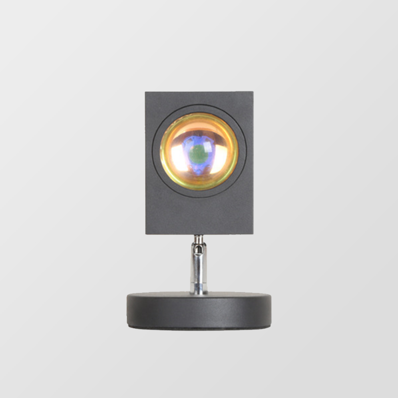 LED-Tischlampe mit rundem Standfuß und farbigem Lichtschein