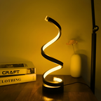 Spiral-Tischlampe mit dekorativem Lichtband und rundem Standfuß